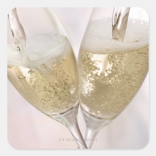 Two champagne flutes being filled with sparkling square sticker (Front)