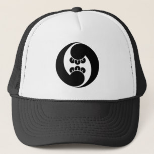 Two counterclockwise clove swirls trucker hat