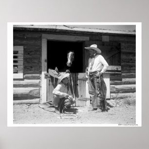 Two cowboys standing next to a barn with a horse poster