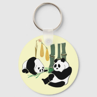 Two Cute Pandas eat bamboo in tropical forest Key Ring
