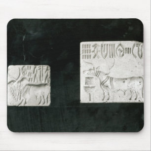Two decorated seals depicting a zebu and a mouse mat