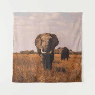 TWO ELEPHANTS WALKING ON GRASS COVERED GROUND TAPESTRY