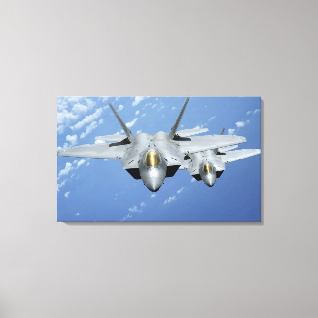 Two F-22 Raptors fly over the Pacific Ocean Canvas Print (Front)