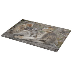 Two female Golden Monkeys with newborns Cutting Board