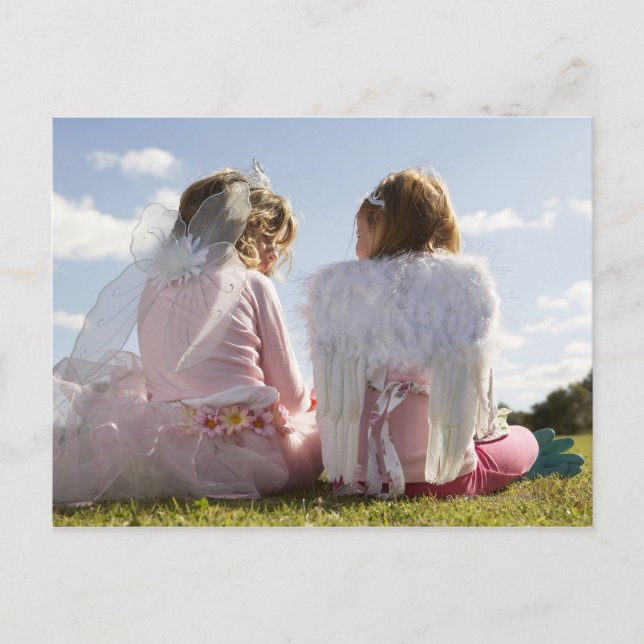 Two girls (7-9) dressed as angel and fairy postcard (Front)