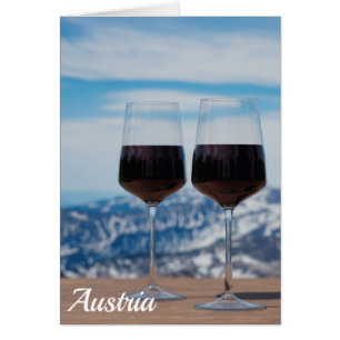 Two glasses of red wine against mountains