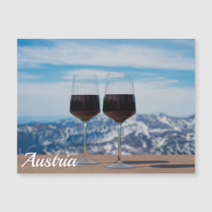 Two glasses of red wine against mountains