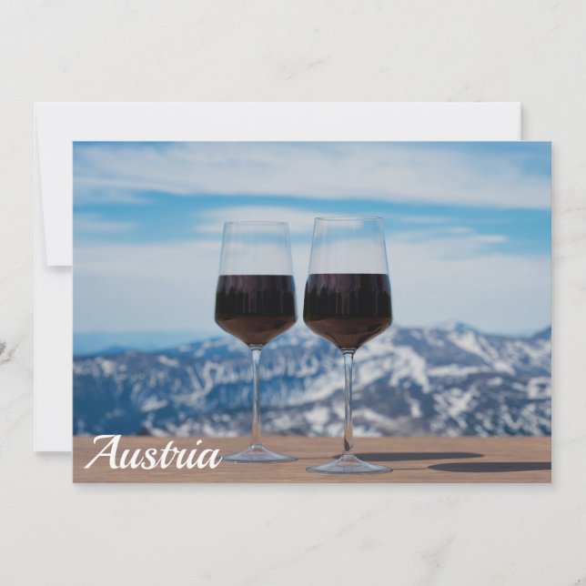 Two glasses of red wine against mountains (Front)
