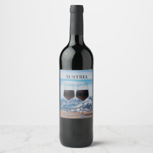 Two glasses of red wine against mountains wine label