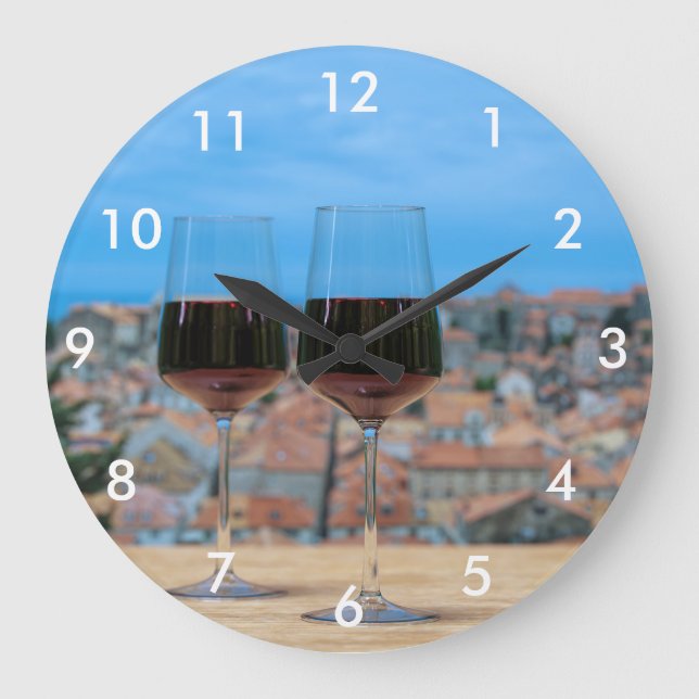 Two glasses of red wine with view of Dubrovnik Large Clock (Front)