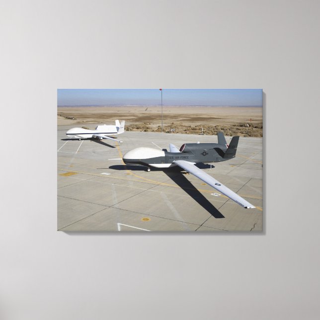 Two Global Hawks parked on a ramp Canvas Print (Front)