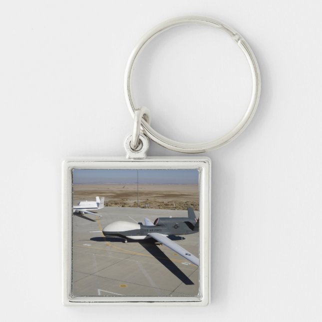 Two Global Hawks parked on a ramp Key Ring (Front)