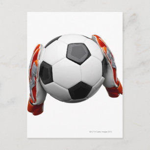 Two goal keepers gloves holding a football postcard