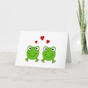 Two green frogs with red hearts. card