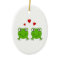 Two green frogs with red hearts.