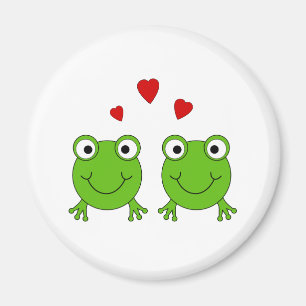 Two green frogs with red hearts. magnet