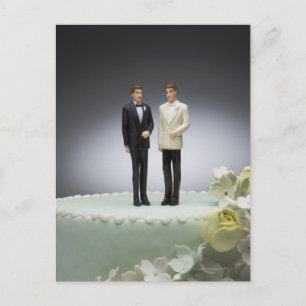 Two groom figurines on top of wedding cake postcard