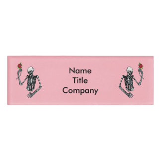 Two Half Skeletons Raised Arms Holding Red Roses Name Tag