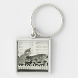 Two kitten playing on piano keyboard, (B&W) Key Ring