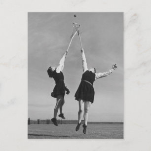 Two lacrosse players jump for the ball. postcard