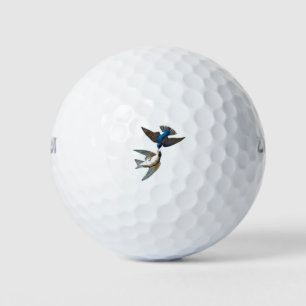 Two little birds flying free in the sky. Vintage c Golf Balls