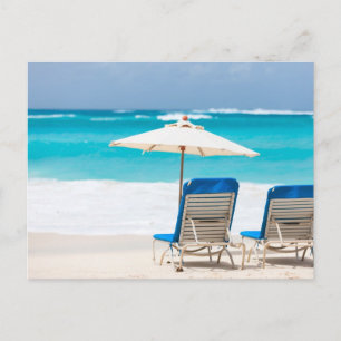 Two lounges on the ocean beach postcard