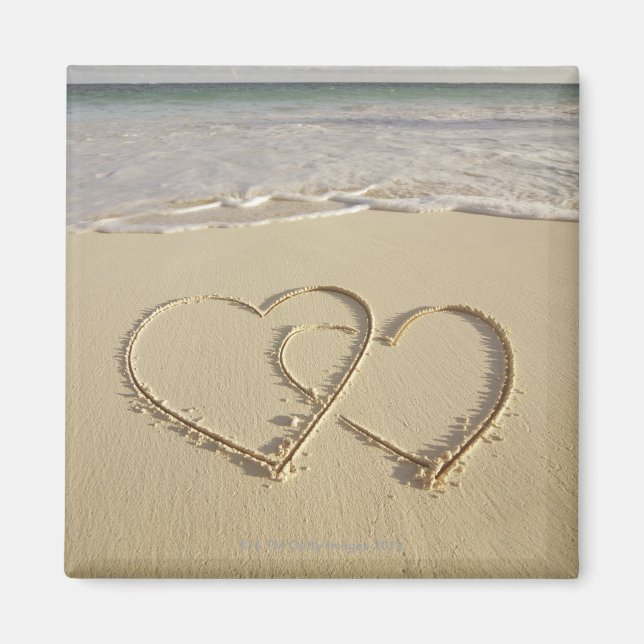 Two overlying hearts drawn on the beach magnet (Front)