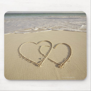 Two overlying hearts drawn on the beach mouse mat