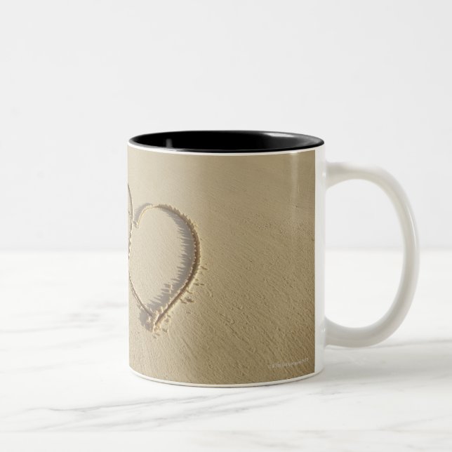 Two overlying hearts drawn on the beach with Two-Tone coffee mug (Right)