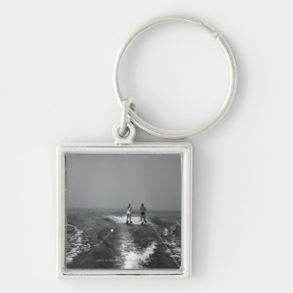 Two people waterskiing key ring