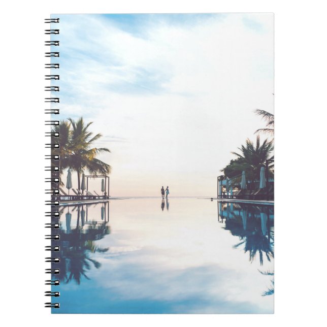 Two person standing beside swimming pool notebook (Front)