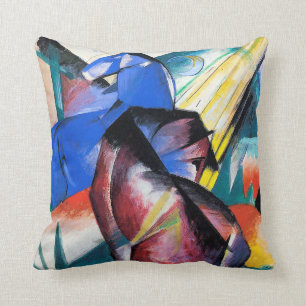 Two red and blue horses by Franz Marc Cushion