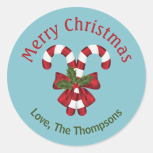 Two Red And White Candy Canes On Blue With Text Classic Round Sticker