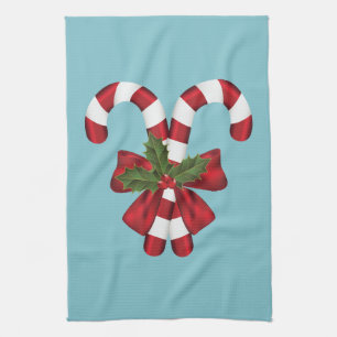 Two Red And White Festive Candy Canes On Blue Tea Towel