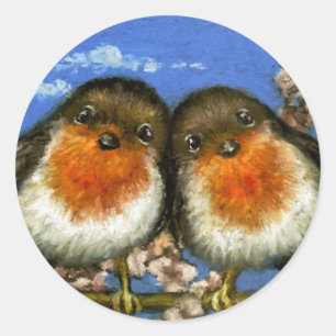 Two robins singing love songs in cherry blossom classic round sticker