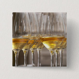 two rows of wine tasting glasses with lucious 15 cm square badge