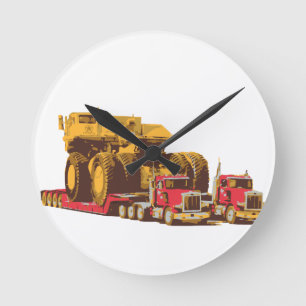Two Semi Big Trucks carrying a Huge Mining Truck Round Clock