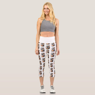 Two skulls and a pumpkin among flowers. capri leggings