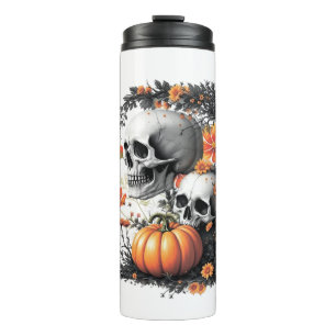 Two skulls and a pumpkin among flowers. thermal tumbler