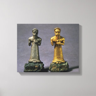 Two statuettes of men carrying offerings of goats, canvas print