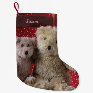 Two teddy bears in a red chair small christmas stocking