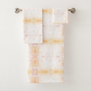 Two towels hang on a silver bar: a larger towel 