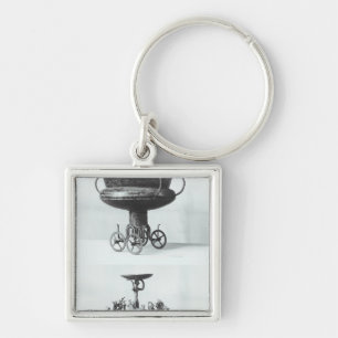 Two votive chariots for collecting rainwater key ring