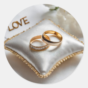 Two wedding rings on a white pillow  classic round sticker