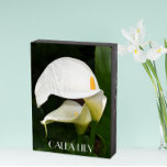 Two White Calla Lilies Floral Wooden Box Sign<br><div class="desc">Black painted,  wooden box sign designed for hanging or standing that features a photo image of two,  gorgeous,  white Calla Lilies along with their green foliage. Text is printed in white lettering. A lovely decoration for the home!</div>
