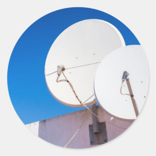 Two white satellite dishes on house wall classic round sticker