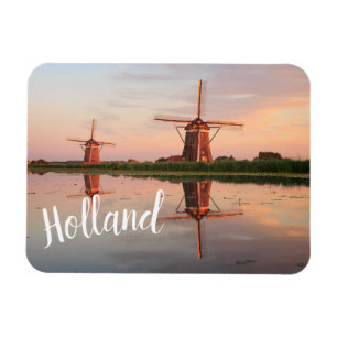 Two windmills with reflection at sunset magnet