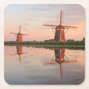 Two windmills with reflection at sunset square paper coaster