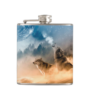 Two wolves howl at the full moon in forest hip flask