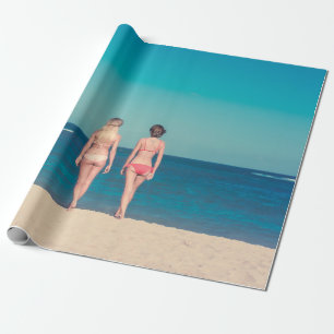 TWO WOMEN WEARING BIKINI STANDING ON SHORE WRAPPING PAPER